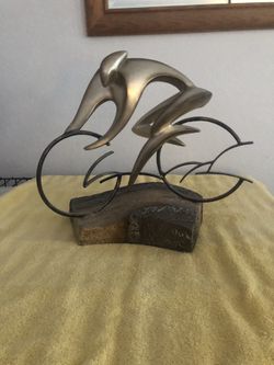 Man / Woman On Bike Statue