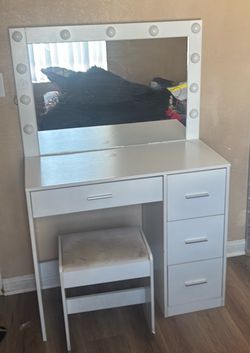 Vanity with mirror and chair
