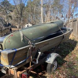 The boat, the trailer, the canoe and the paddleboard 