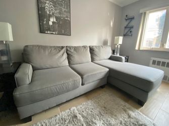 Light Gray Ashley HomeStores Sectional Sofa with Rightside Chaise