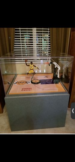 Show case with half lakers court and accessories.