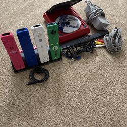 Wii with 4 remotes, steering wheels, Super Smash Bros, and more