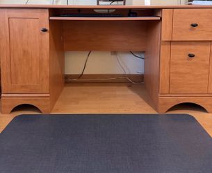 Wooden desk with keyboard tray and drawers