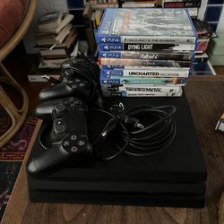 PS4, 2 Controllers, and Games