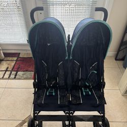 Delta Children’s LX Side by Side Stroller Good Condition, Only Rip on Back Storage Bag 
