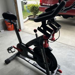 Schwinn IC4 bike with mat and extra seat cushion