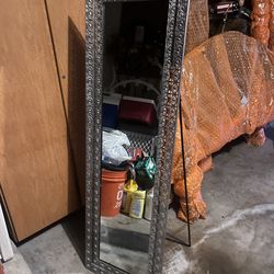 Free standing metal mirror