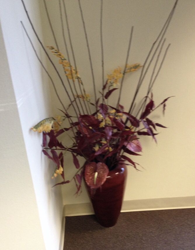 Floor vases with ornamental flowers