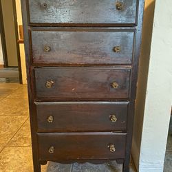 Antique wooden chest of drawers with glass  knobs