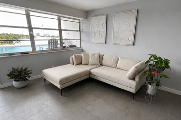 Light Gray Sectional Sofa with Ottoman – Good Condition