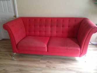 Red Chesterfield style couch