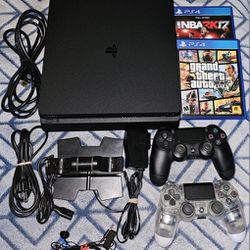 PS4 Slim 2 Duel Shock Controllers/charger. Plus 2 Games.