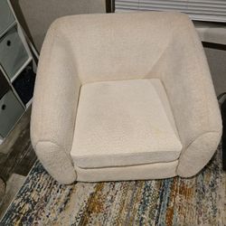 Two white boucle chairs