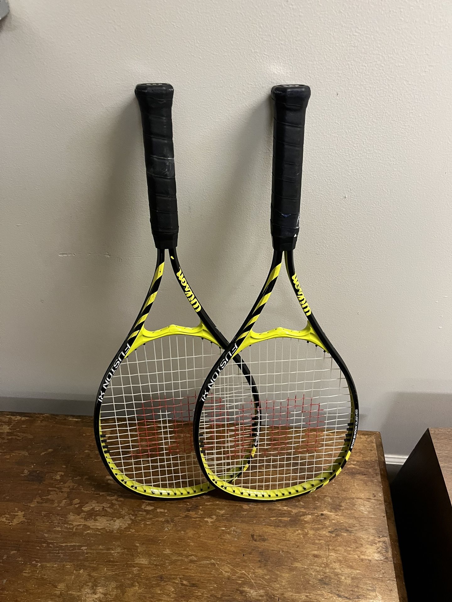 Matching set of tennis rackets, good condition, ready for play.