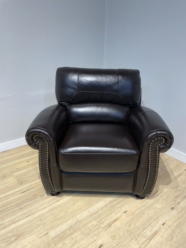 Dark brown leather arm chair