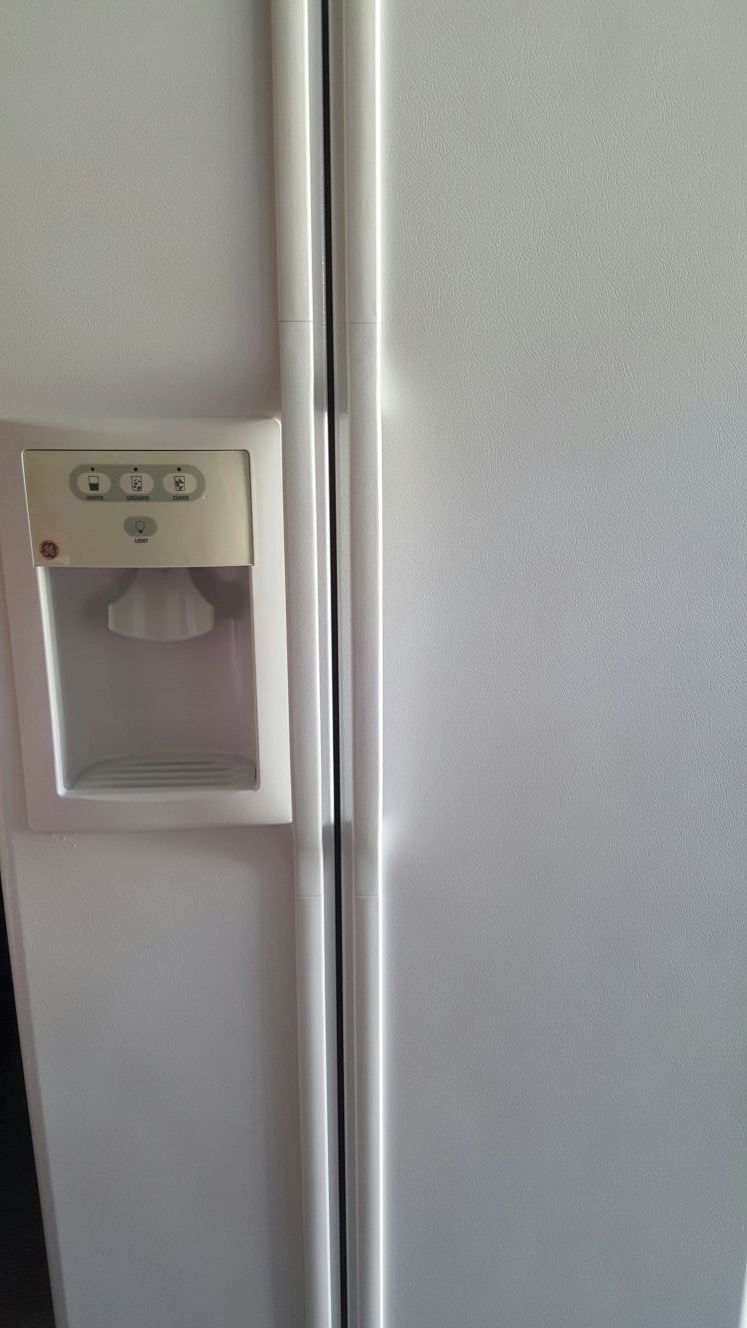 Ge white side by side refrigerator