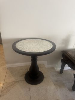 Wooden Round Table With One Stand . The Color Is Black.