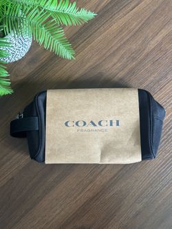 Brand New Coach Toiletry Pouch! Brand new black Coach Fragrance toiletry pouch — still in original packaging! Sturdy, zippered design with handle. Per