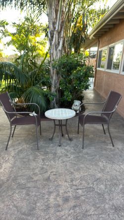 2 chairs with table