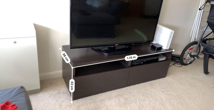 TV stand from Ikea with storage drawers in brown-black