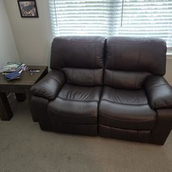 Leather love seat with electric footrest