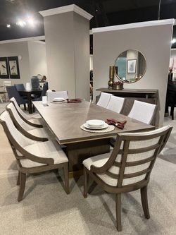 Versatile style dining sets w/unique base starts at $995.00