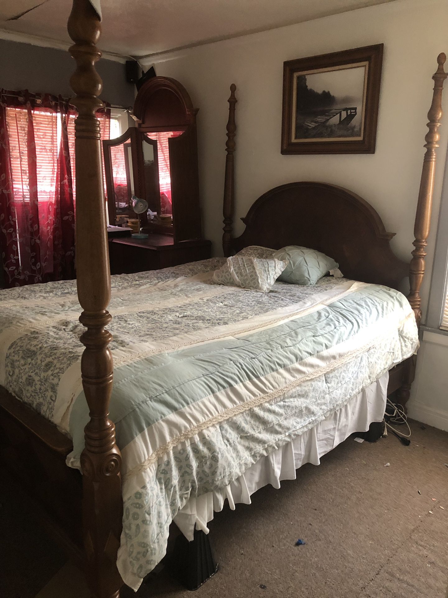 Queen size poster bed frame and box spring. Good condition. Needs a good home.