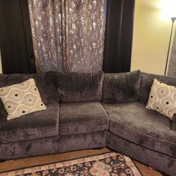 Soft gray cuddler couch 