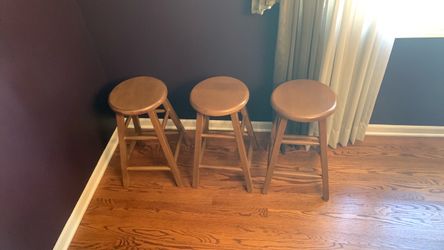Three wooden stools