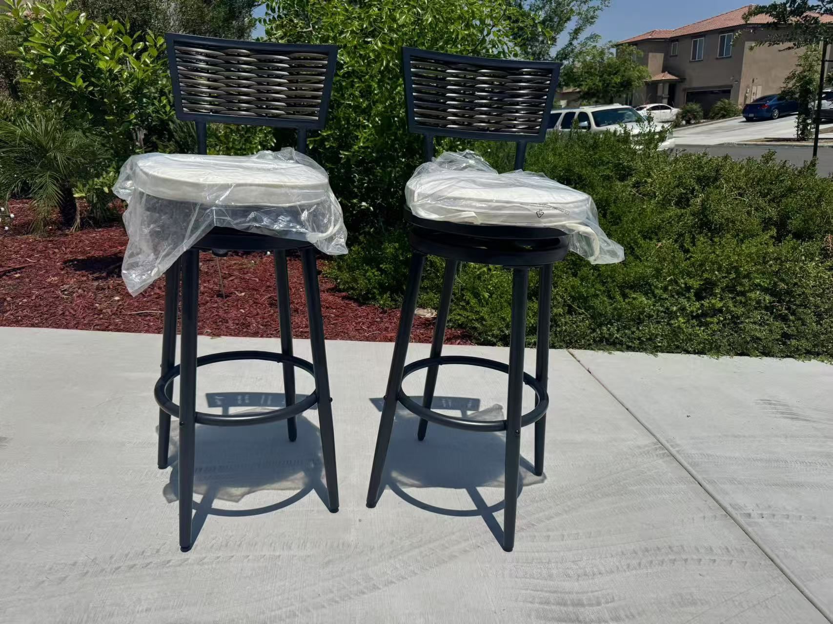 2 iron swivel bar stools