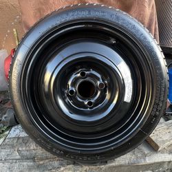 1 GOOD USED DONUT SPARE TIRE FOR HONDA 15X4   4X100 T125/70D15 BRIDGESTONE TIRE $35 PICKUP ONLY 