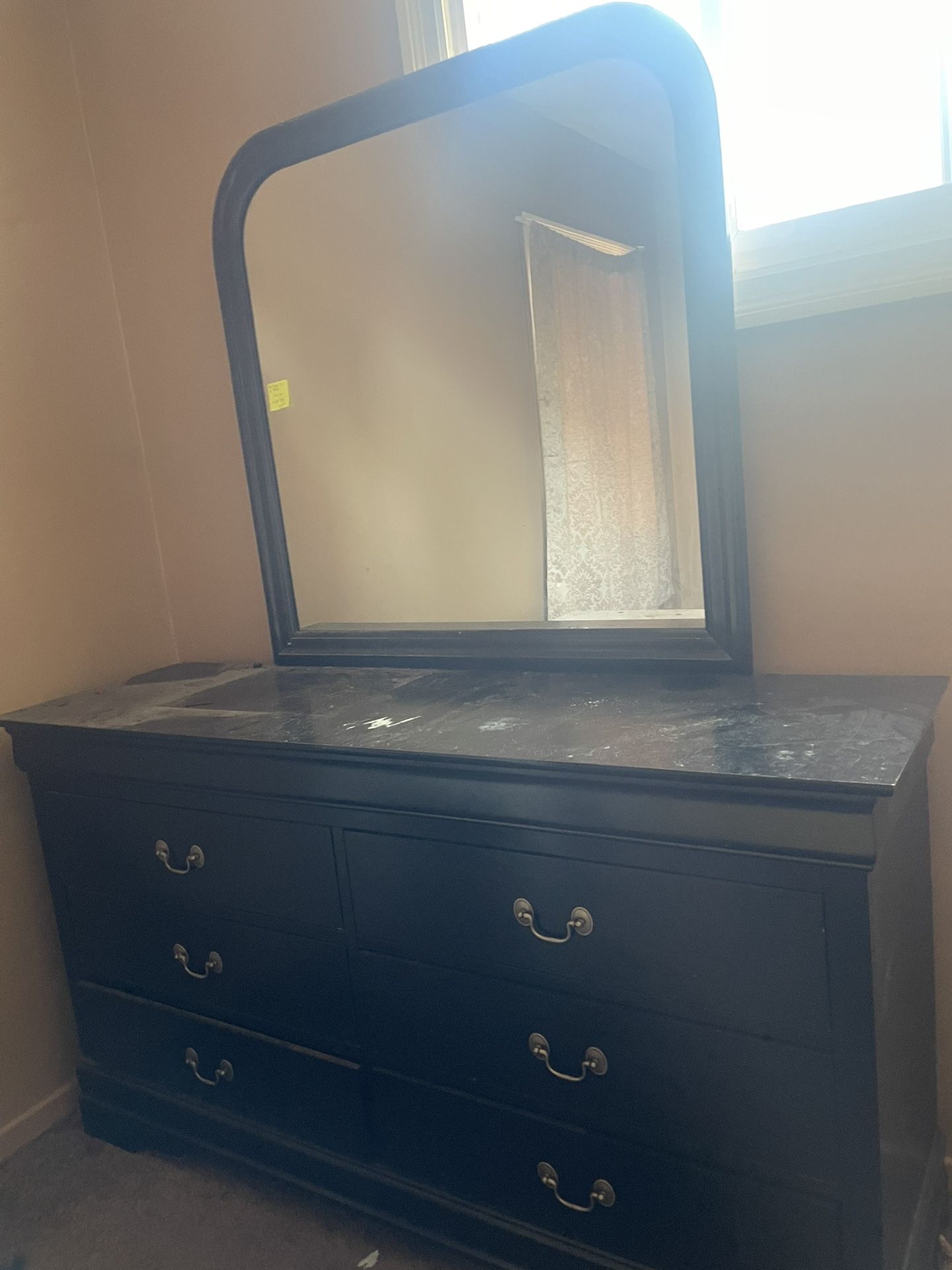 Dresser with mirror attached