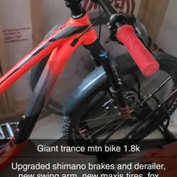 Giant trance mtn bike 1.8k comes with new schwin helmet.