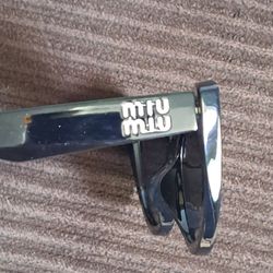 EXCELLENT CONDITIONS AUTHENTIC " MIU MIU SUNGLASSES 50$
