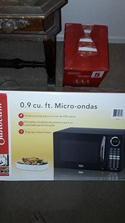 Brand new microwave still in box .9 cu ft., black (never opened)