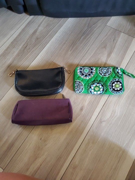 and makeup case set by Vera Bradley and Estee Lauder and a no name brand.