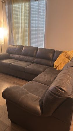 2 - Piece Sectional And Ottonman