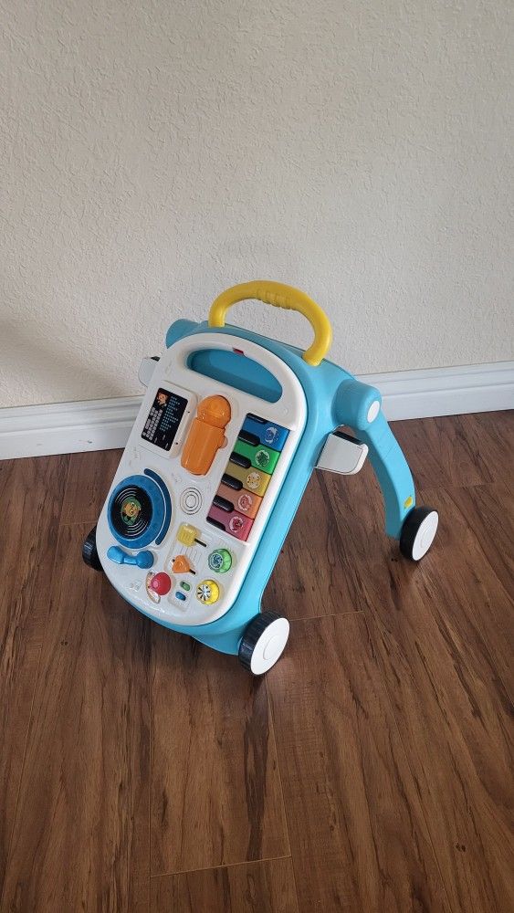 Baby Einstein Musical Mix ‘N Roll 4-in-1 Push Walker, Activity Center, Toddler Table and Floor Toy.