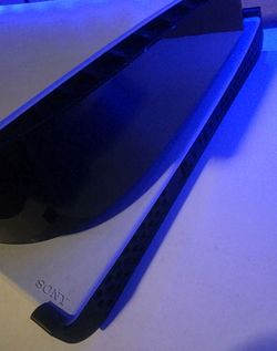 3D-printed horizontal stands designed for the PlayStation 5 console