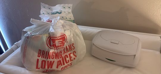 Nb diapers/size 2 , wipe warmer ,socks, mittens and bibs