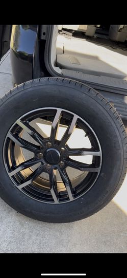One Michelin Alloy rim And Tire.