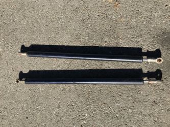 Truck camper strut shock absorber.