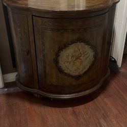 Traditional European demilune cabinet (half-moon shape).