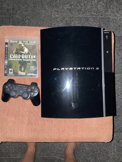 PlayStation 3 with game and controller