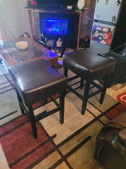 Two Twin leather bar stools