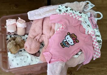 Bin of baby girl clothes