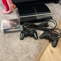 PlayStation 3 With Two Controllers And Three Games