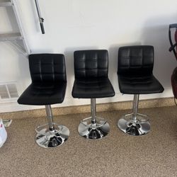 3 Black Adjustable Bar Stools. Great Condition. $600 Value
