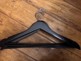Black wooden hangers.