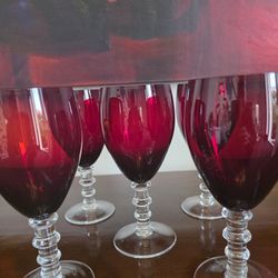Set of five vintage ruby red wine glasses with clear segmented ball stems.